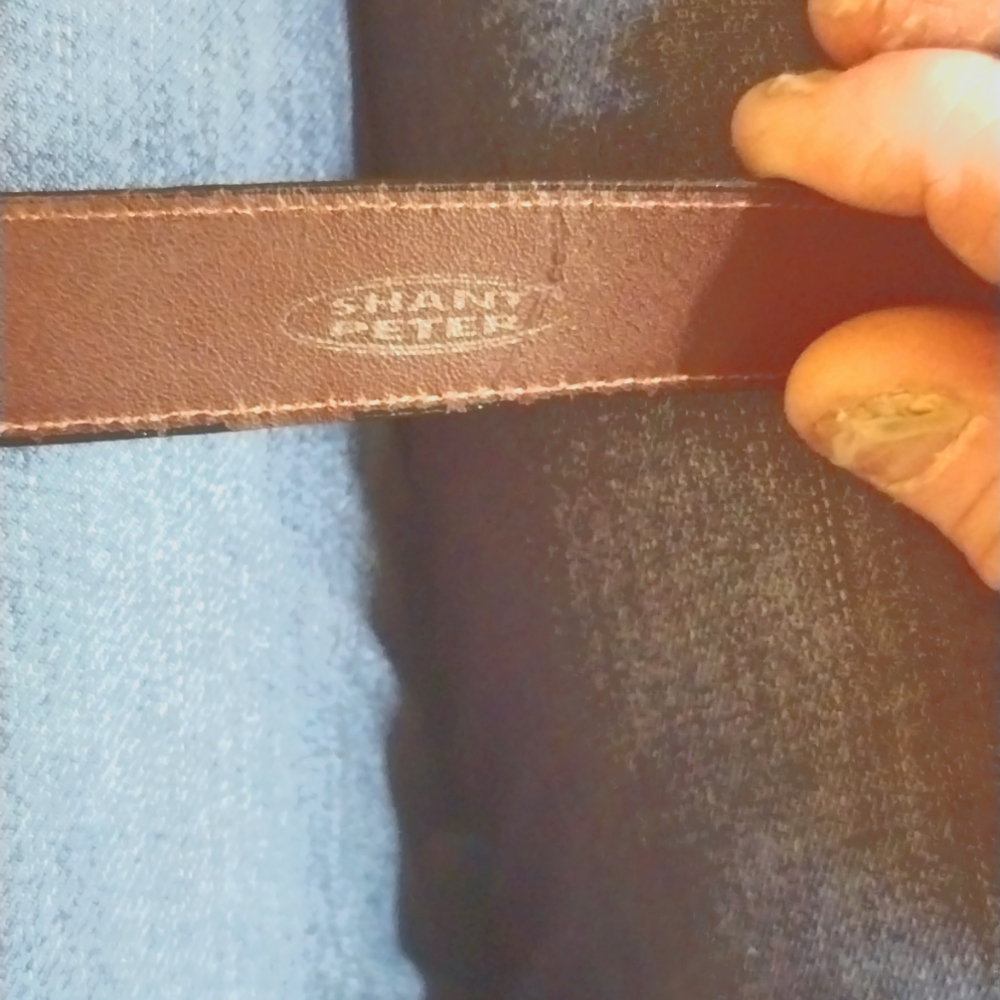 A vintage 36-in black lizard skin sterling silver belt